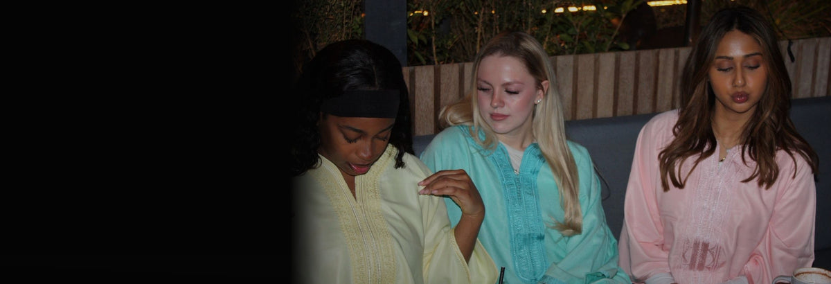 Three models wearing Zina Zina gandouras